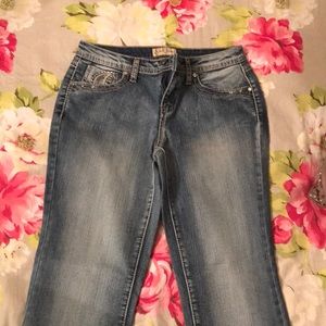 Faded blue jeans with comfortable fit.
